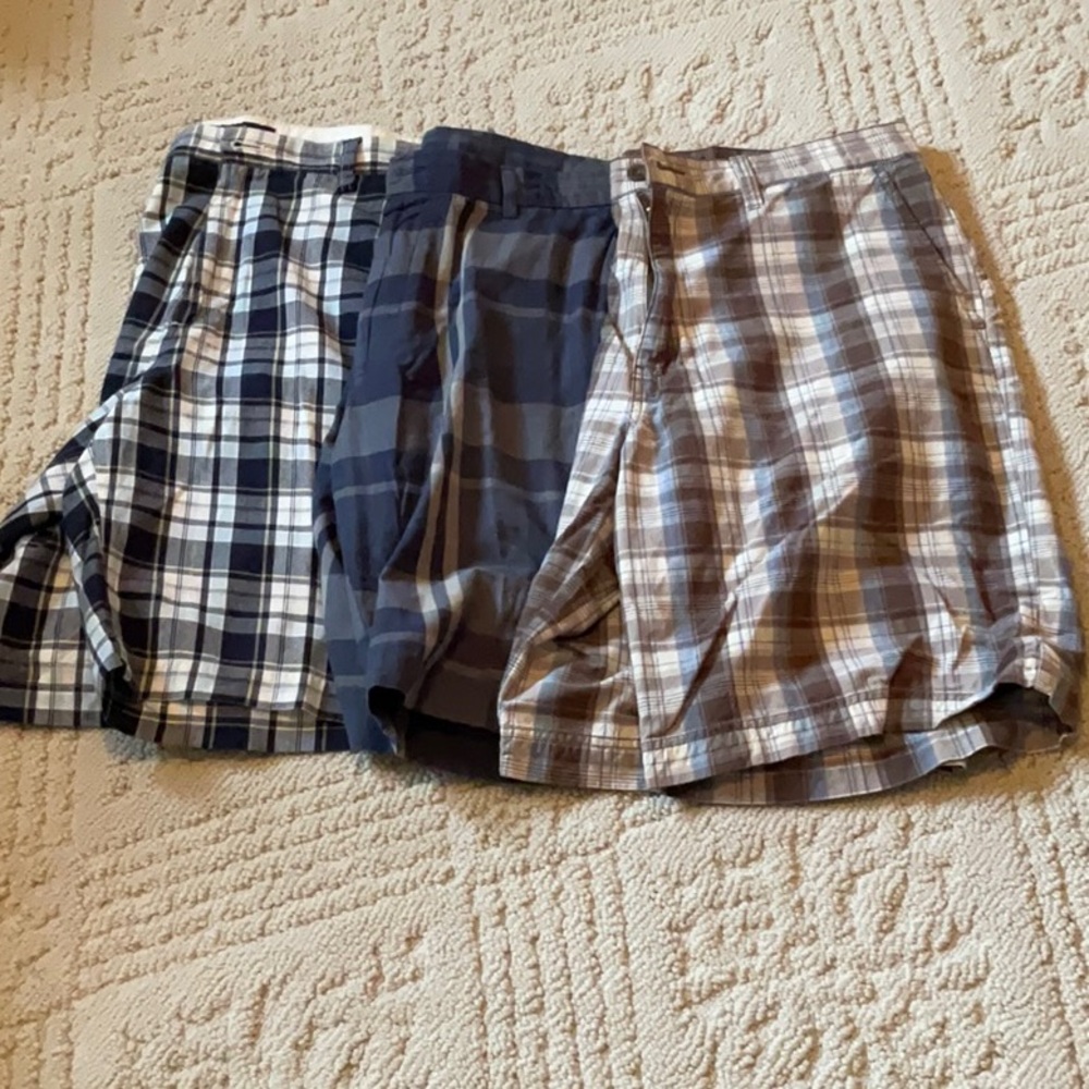 Three pair of men’s size 34 flat front plaid shorts.